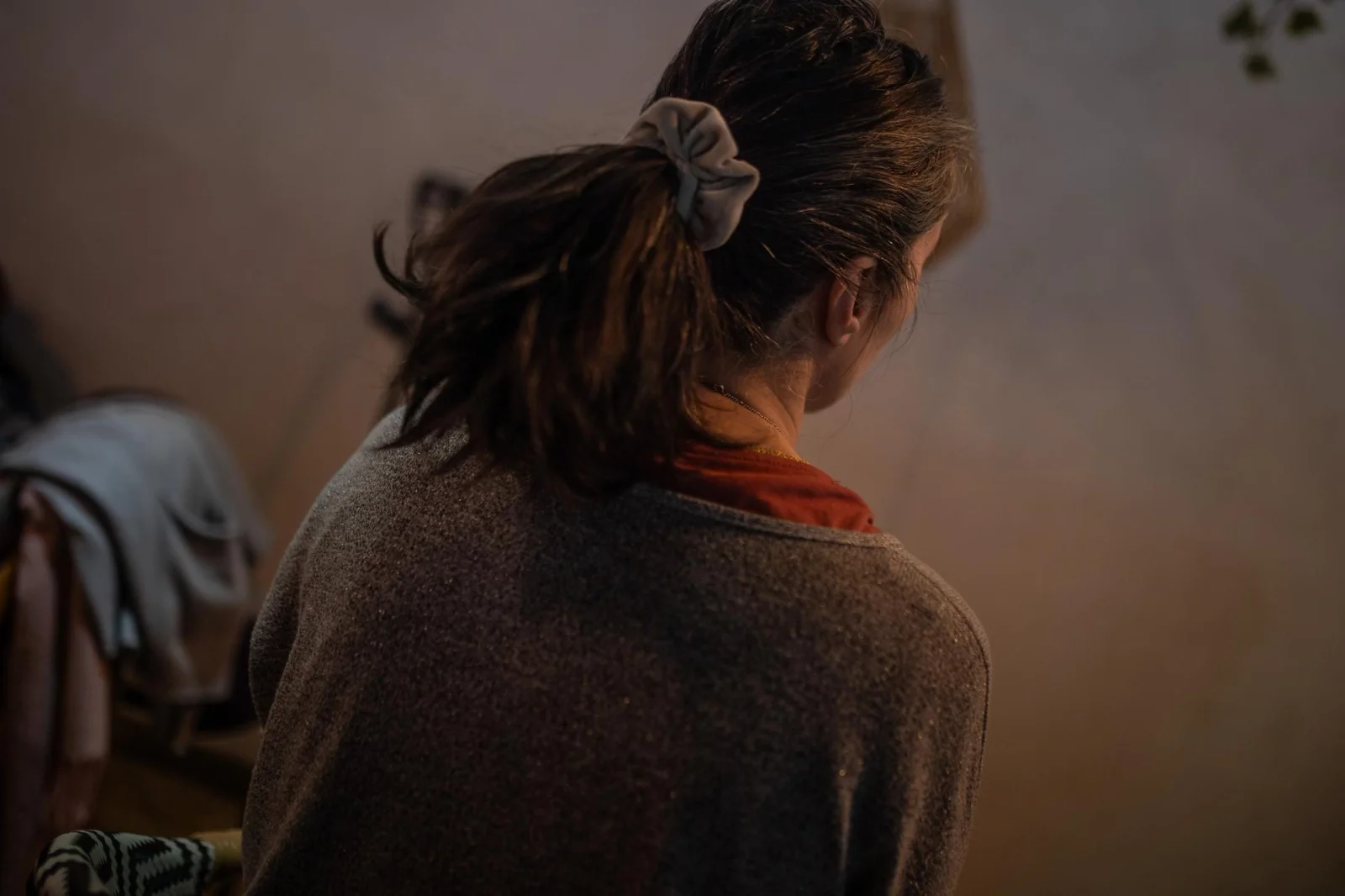 A survivor of the congregation photographed from behind