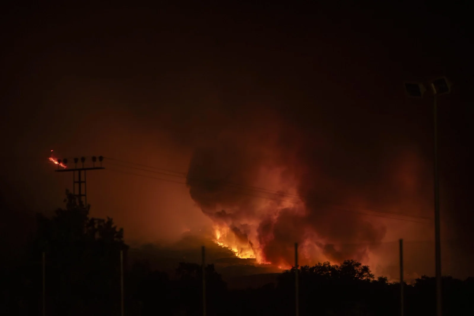 Night view of the fire advancing and illuminating the