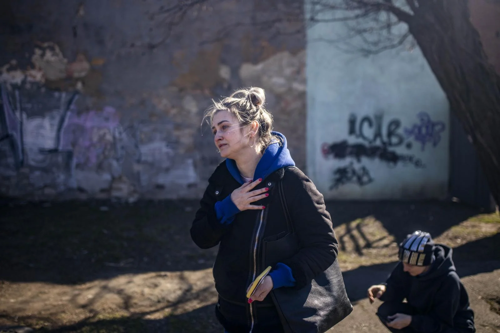 Ana, 37, after finding the lifeless body of her father who disappeared three days ago in a bombing in the southern Ukrainian town of Mykolaiv. The town is a key point for Russian troops in their advance towards Odessa... Out of a population of 500,000, more than half have already fled westwards. The morgue is overflowing with bodies, and of the 30 corpses arriving each day, more than a third are civilians
