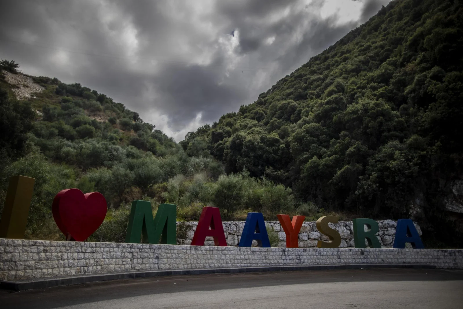 Sign at the entrance road of the town of Maaysra, where