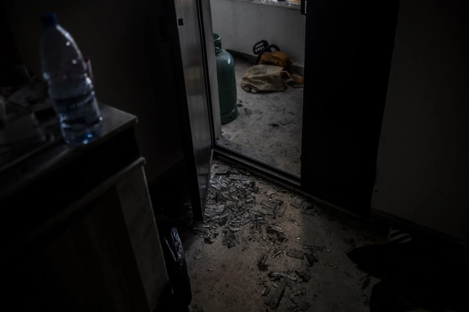 Remains of broken glass on the kitchen floor of a house