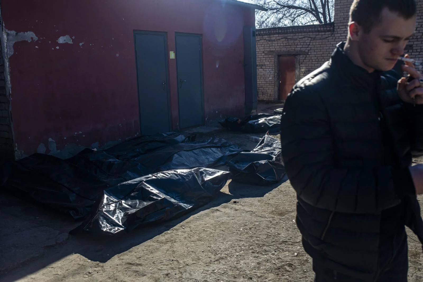 Entrance to the Mykolaiv morgue where bodies are piling up and overflowing; of the 30 corpses arriving each day, more than a third are civilians. In the mornings, many relatives come in search of their loved ones.